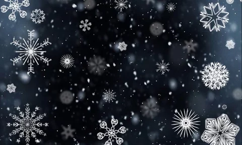 Gezeichnete Schneeflocken vor dunkelblauem Hintergrund